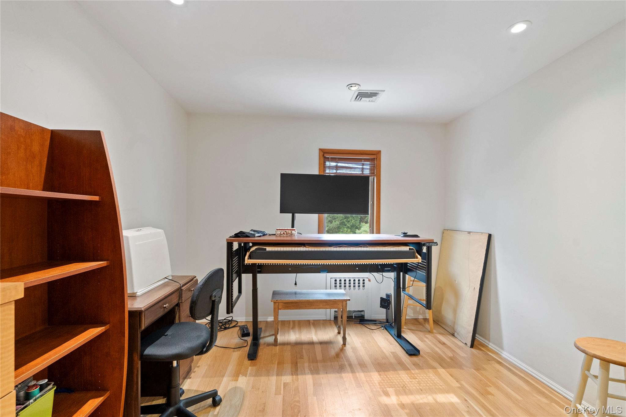 33 Shelter Hill Road Plainview, NY 11803 - Photo 18 of 34 Bedroom featuring wood finished floors, recessed lighting.