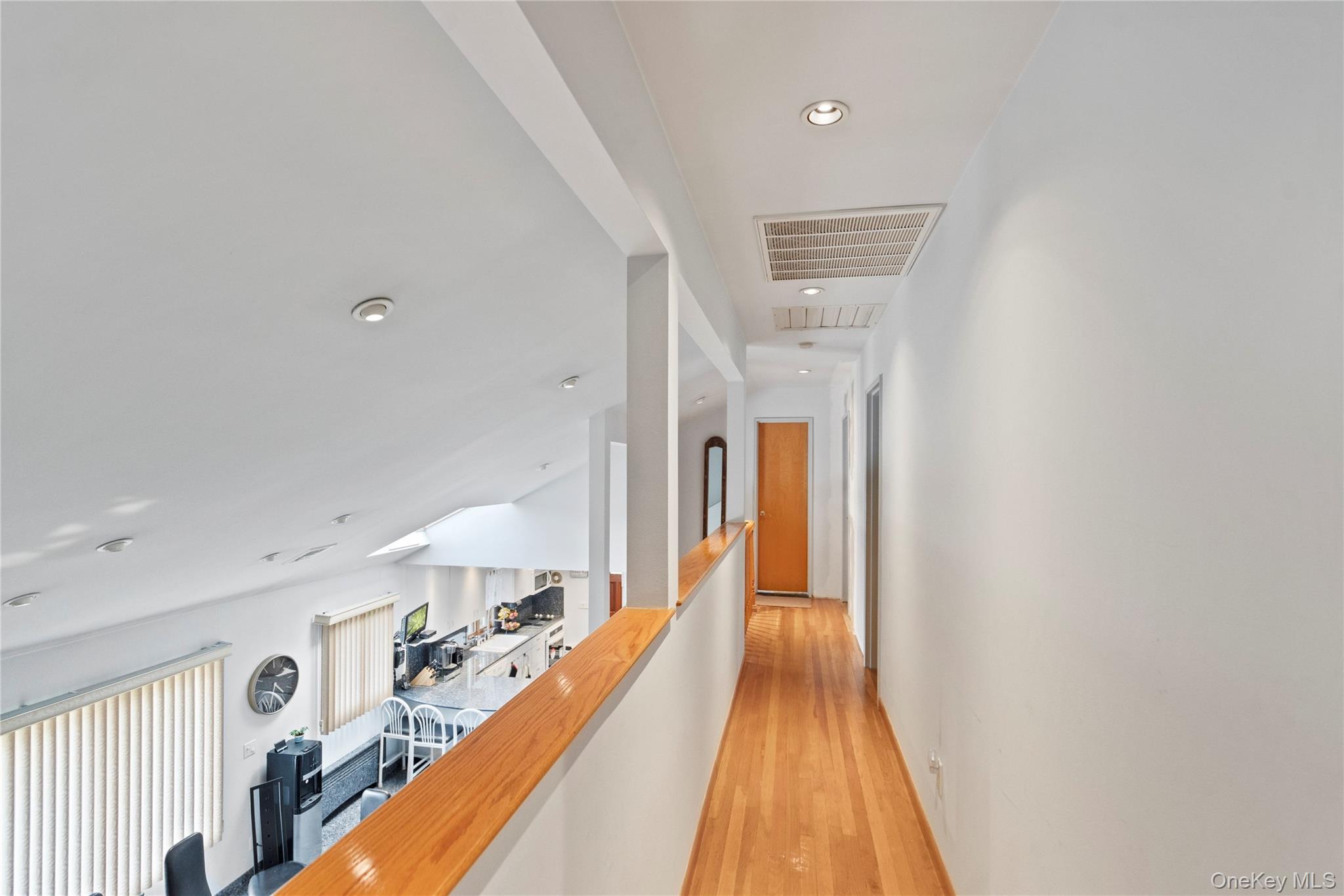 33 Shelter Hill Road Plainview, NY 11803 - Photo 21 of 34 Hall featuring light wood-style flooring, an upstairs landing, and recessed lighting