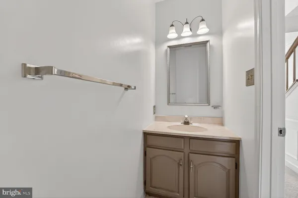 an entryway to room with wooden floor and windows