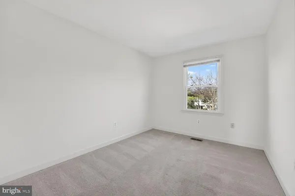 a bathroom with a sink toilet vanity and shower
