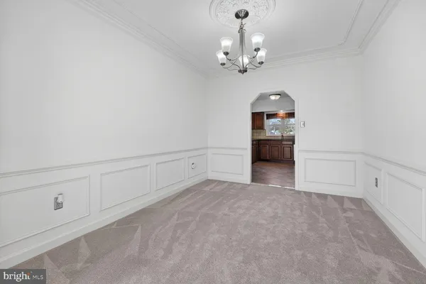 a view of a chandelier and entryway