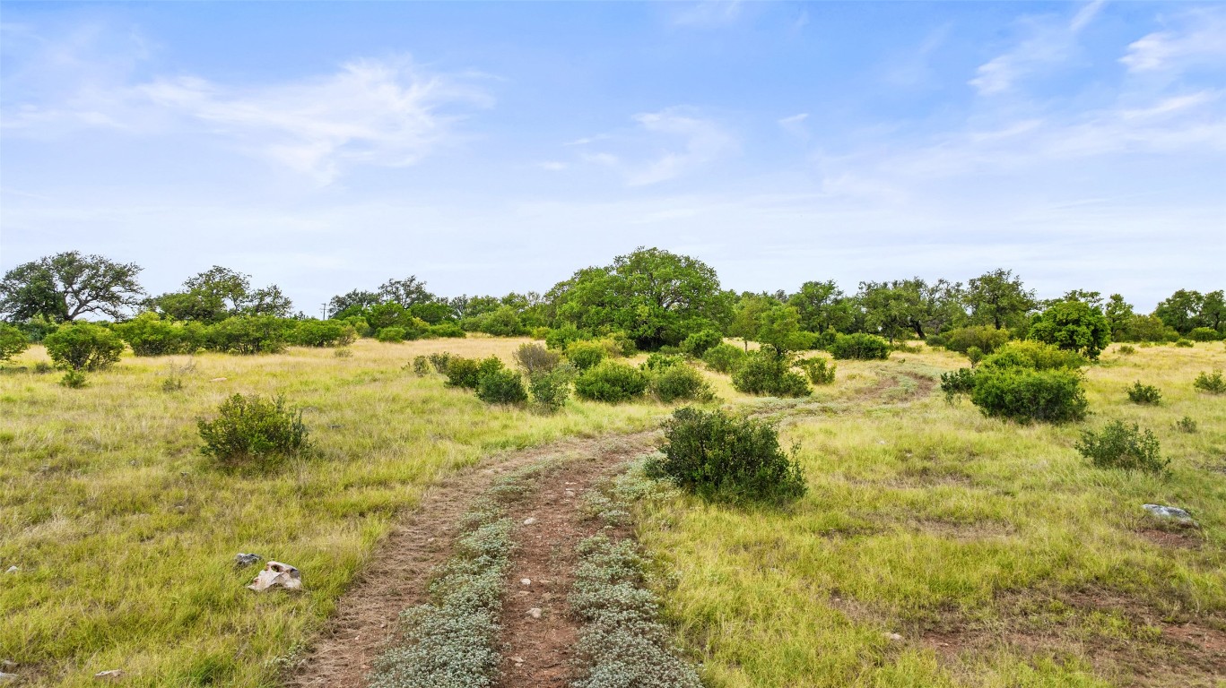Lot 37 Vista Rdg Drive Round Mountain, TX 78663 - Photo 18 of 30 a view of a lake with houses in the back