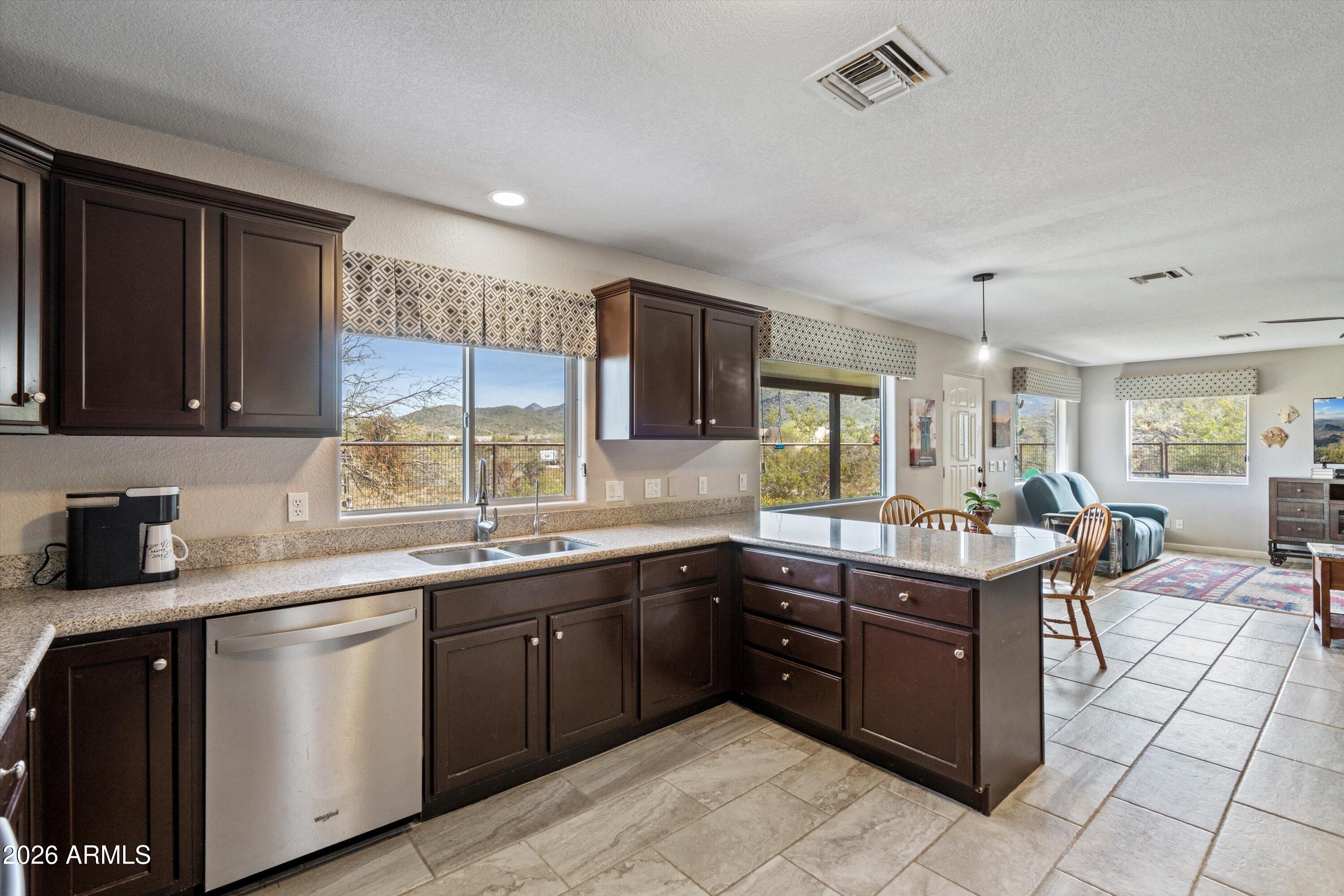 2316 West White Spar Road New River, AZ 85087 - Photo 11 of 40 a kitchen with a sink and cabinets