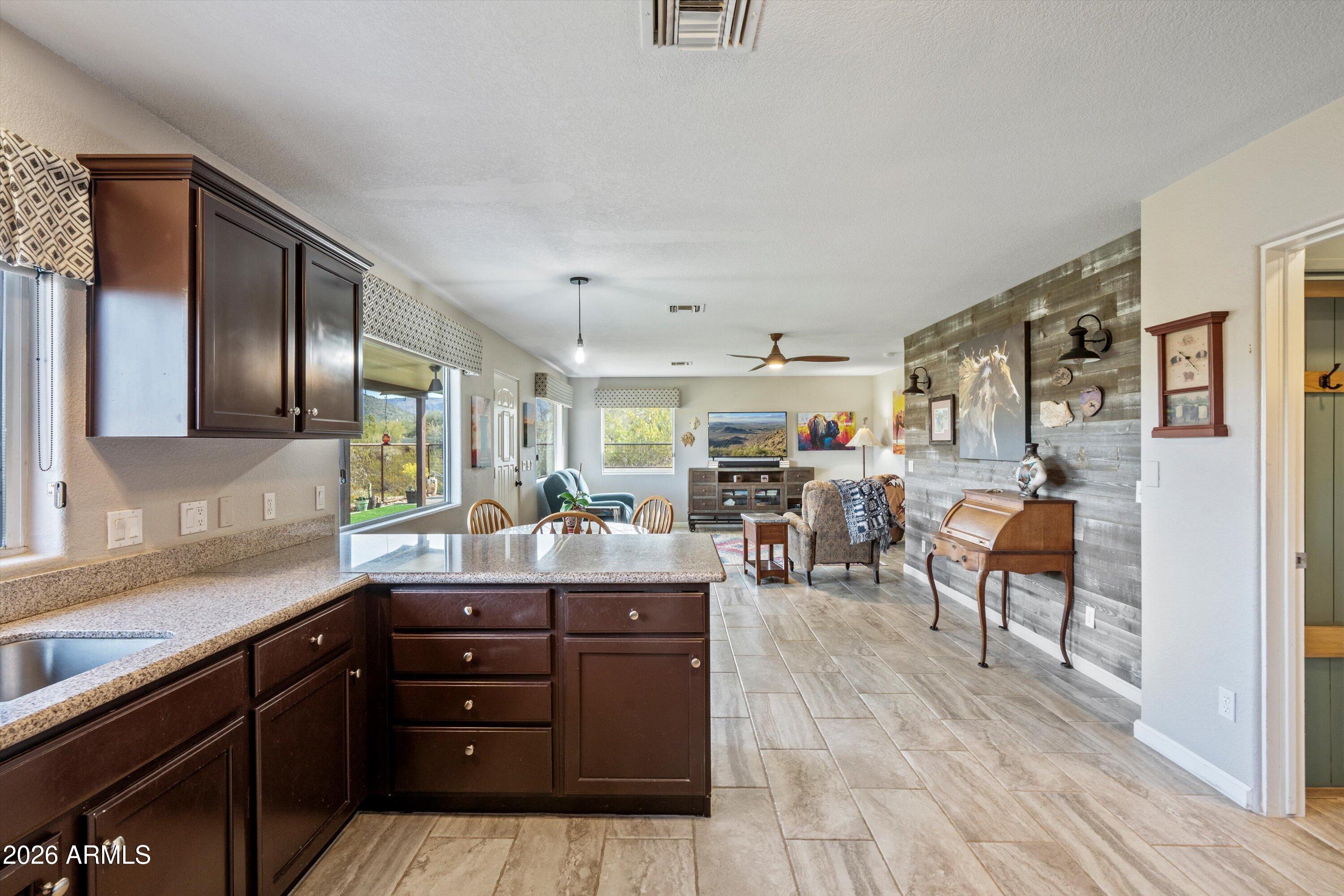 2316 West White Spar Road New River, AZ 85087 - Photo 13 of 40 a kitchen with a table and chairs