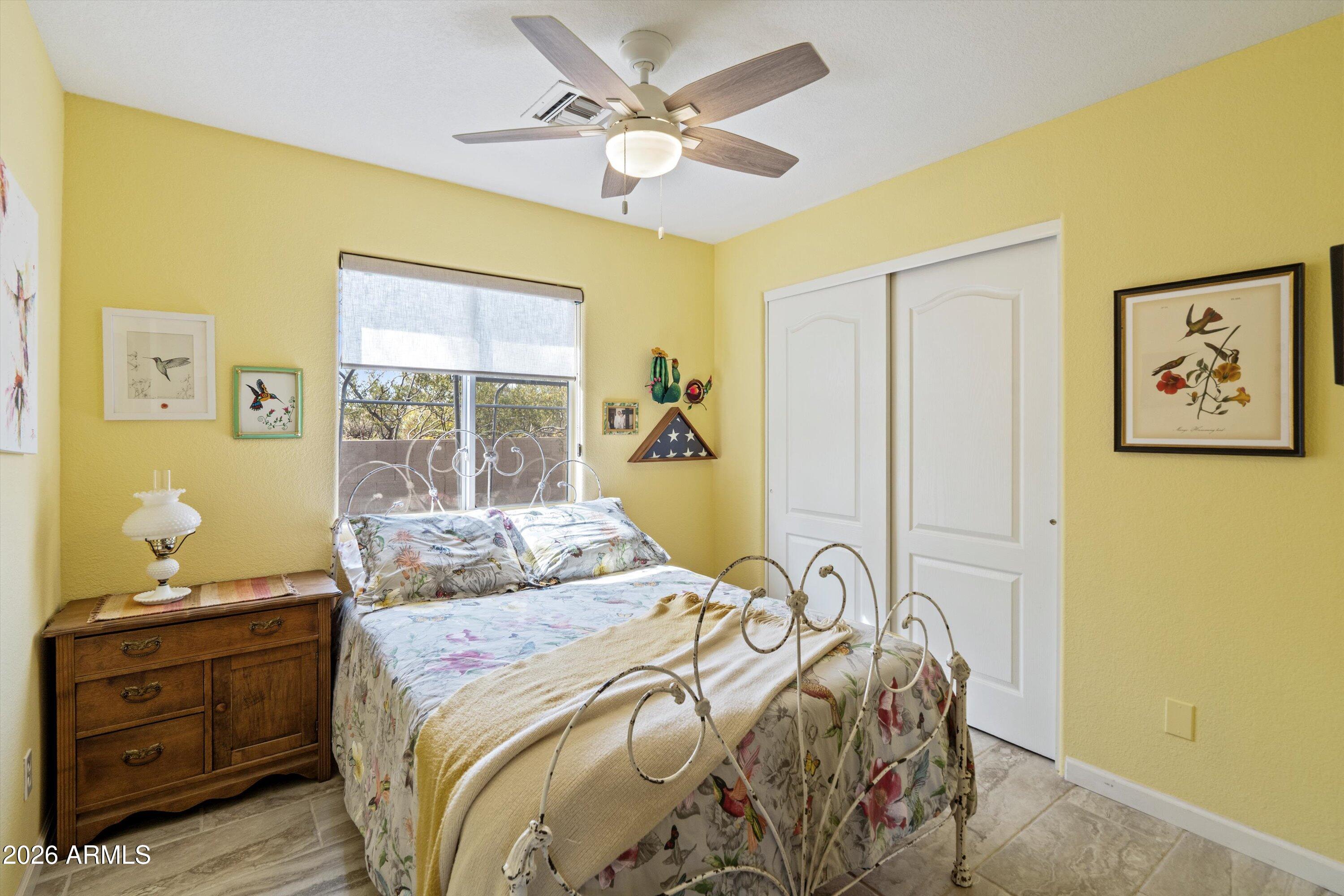 2316 West White Spar Road New River, AZ 85087 - Photo 20 of 40 a bedroom with a bed and a window