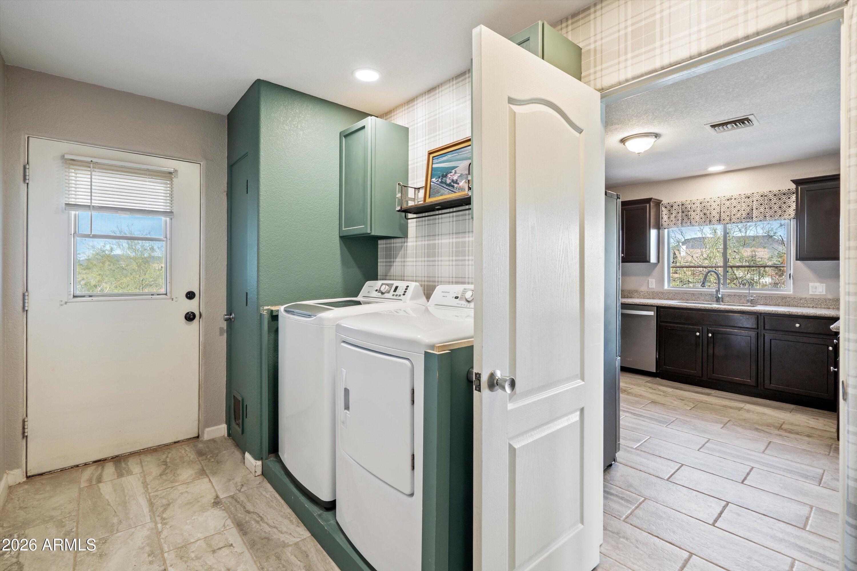 2316 West White Spar Road New River, AZ 85087 - Photo 23 of 40 a bathroom with a sink a toilet and a mirror