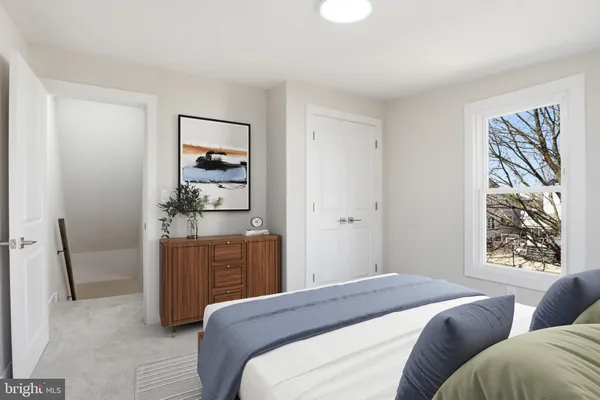a bedroom with a bed and dresser
