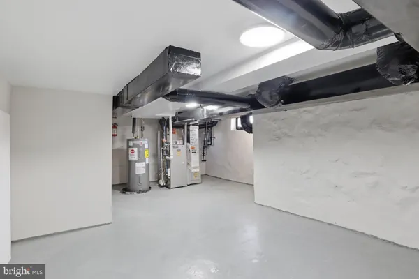 a utility room with refrigerator dryer and washer