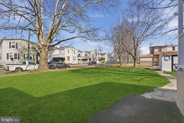 a picture of a bench in front of a wall