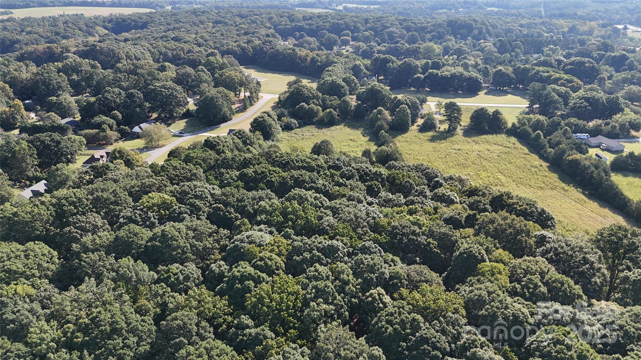 3004 Potter Road Waxhaw, NC 28173 - Photo 11 of 15 an aerial view of a house with a yard and large trees