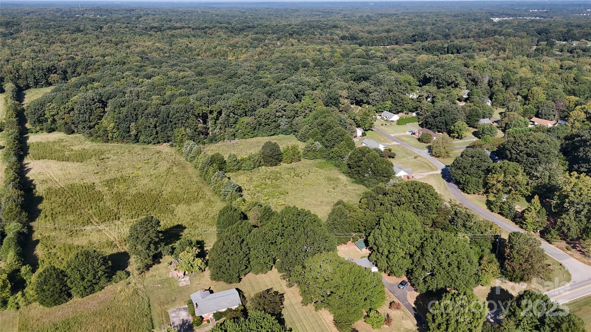 3004 Potter Road Waxhaw, NC 28173 - Photo 15 of 15 a view of a houses with green field