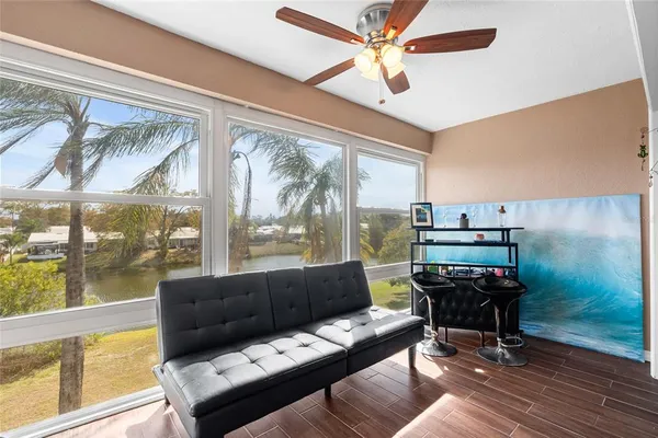 a living room with furniture and a large window