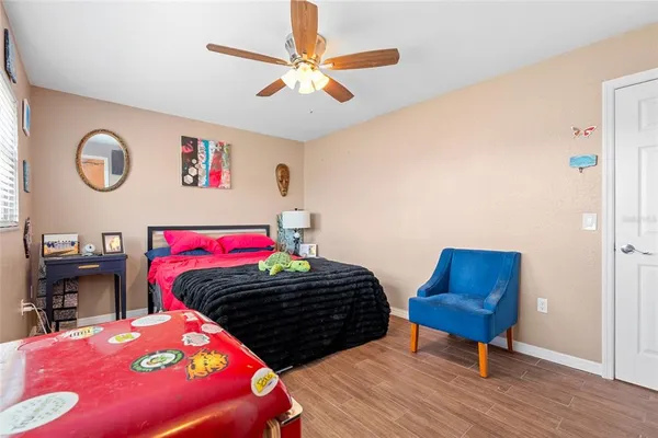 a bedroom with a bed and a dresser in it