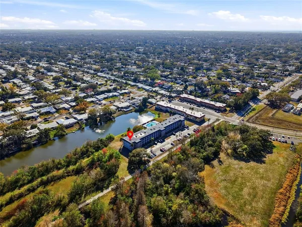 an aerial view of residential houses with outdoor space