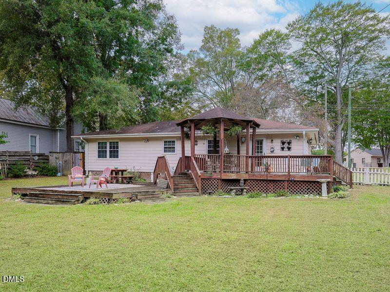 524 Marshburn Road Wendell, NC 27591 - Photo 40 of 46 a house view with a seating space and garden