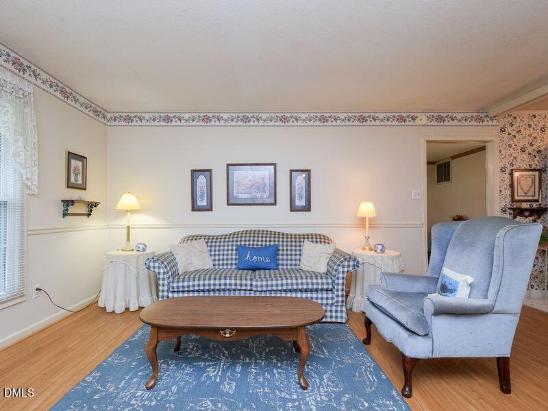 524 Marshburn Road Wendell, NC 27591 - Photo 6 of 46 a bedroom with furniture and a wooden floor