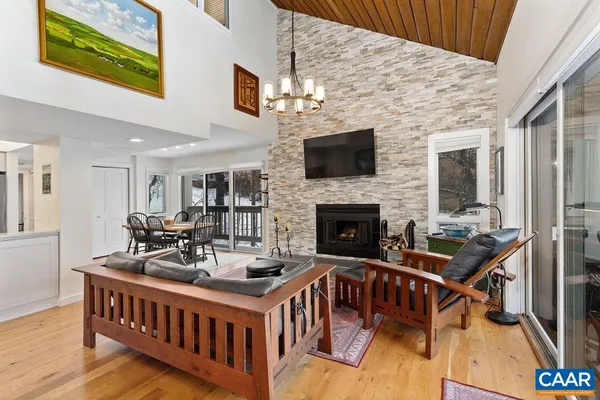 a dining room with furniture window and wooden floor