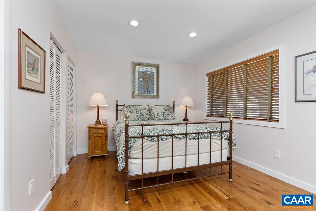 1478 Ledges Condos Roseland, VA 22967 - Photo 26 of 50 a bedroom with a bed and wooden floor