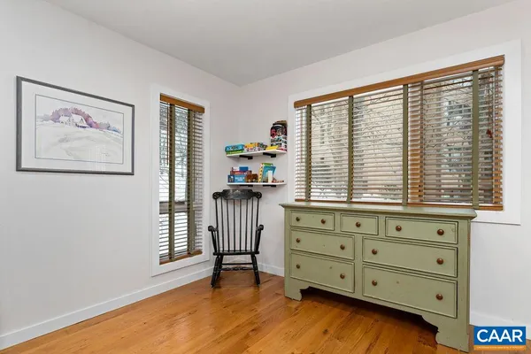 a view of a bedroom with a washer and dryer