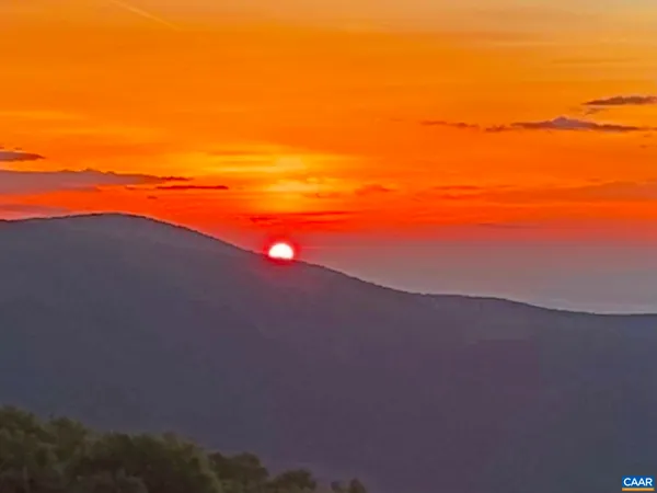 a living room with furniture fireplace and flat screen tv