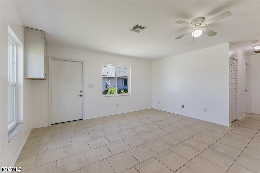 16595 Davis Road Fort Myers, FL 33908 - Photo 18 of 31 wooden floor in an empty room with a window