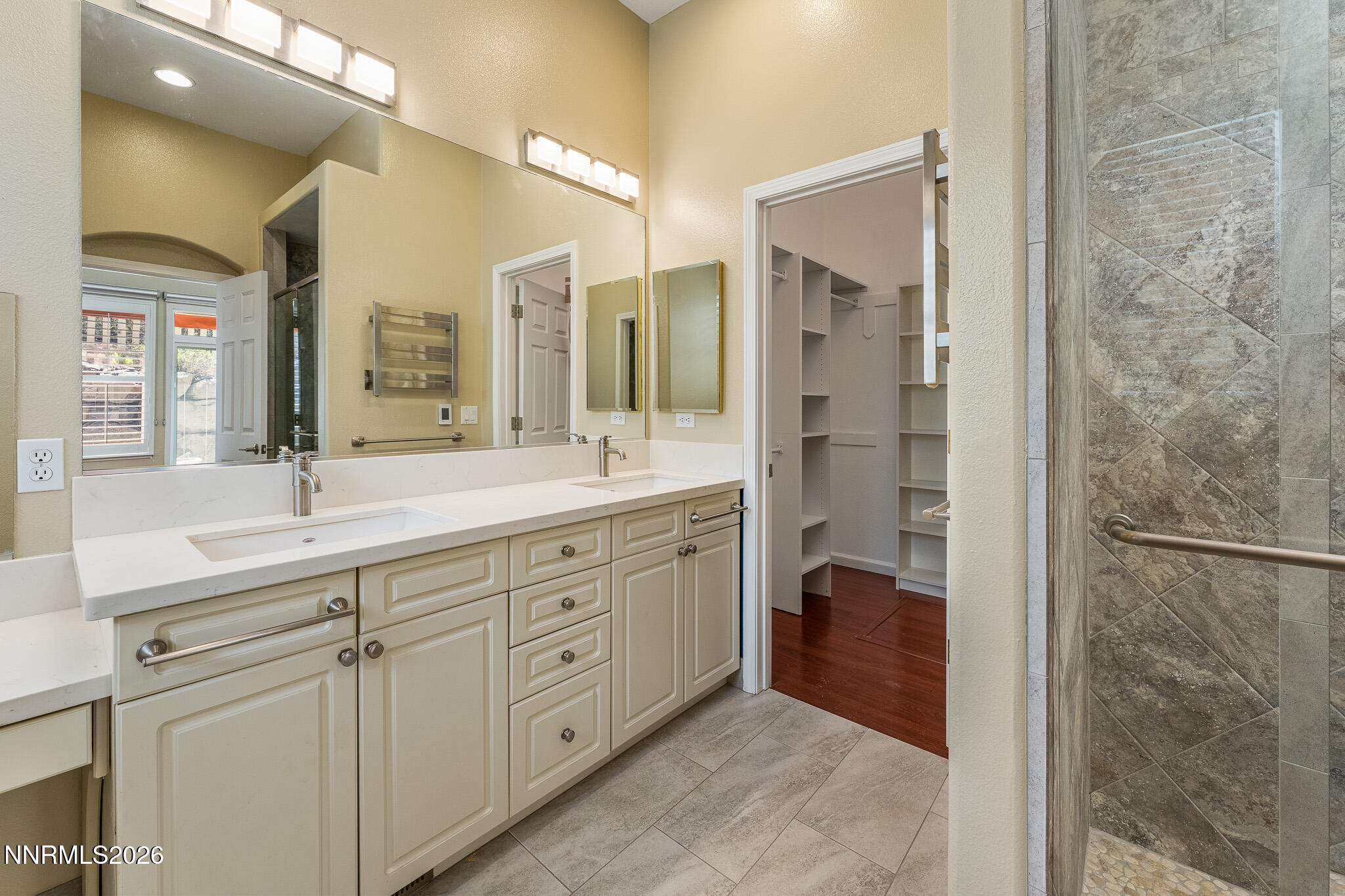 1840 Hunter Creek Road Reno, NV 89519 - Photo 17 of 39 a spacious bathroom with a double vanity sink a mirror and a shower