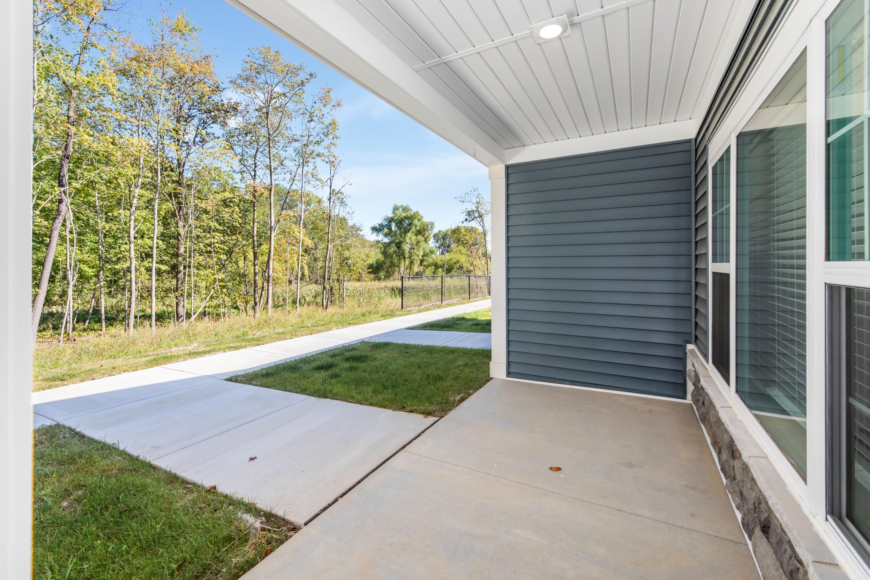 1811 West Wysteria Lane, Unit 605 Oak Creek, WI 53154 - Photo 16 of 33 Each unit has a covered porch (shown) and private patio