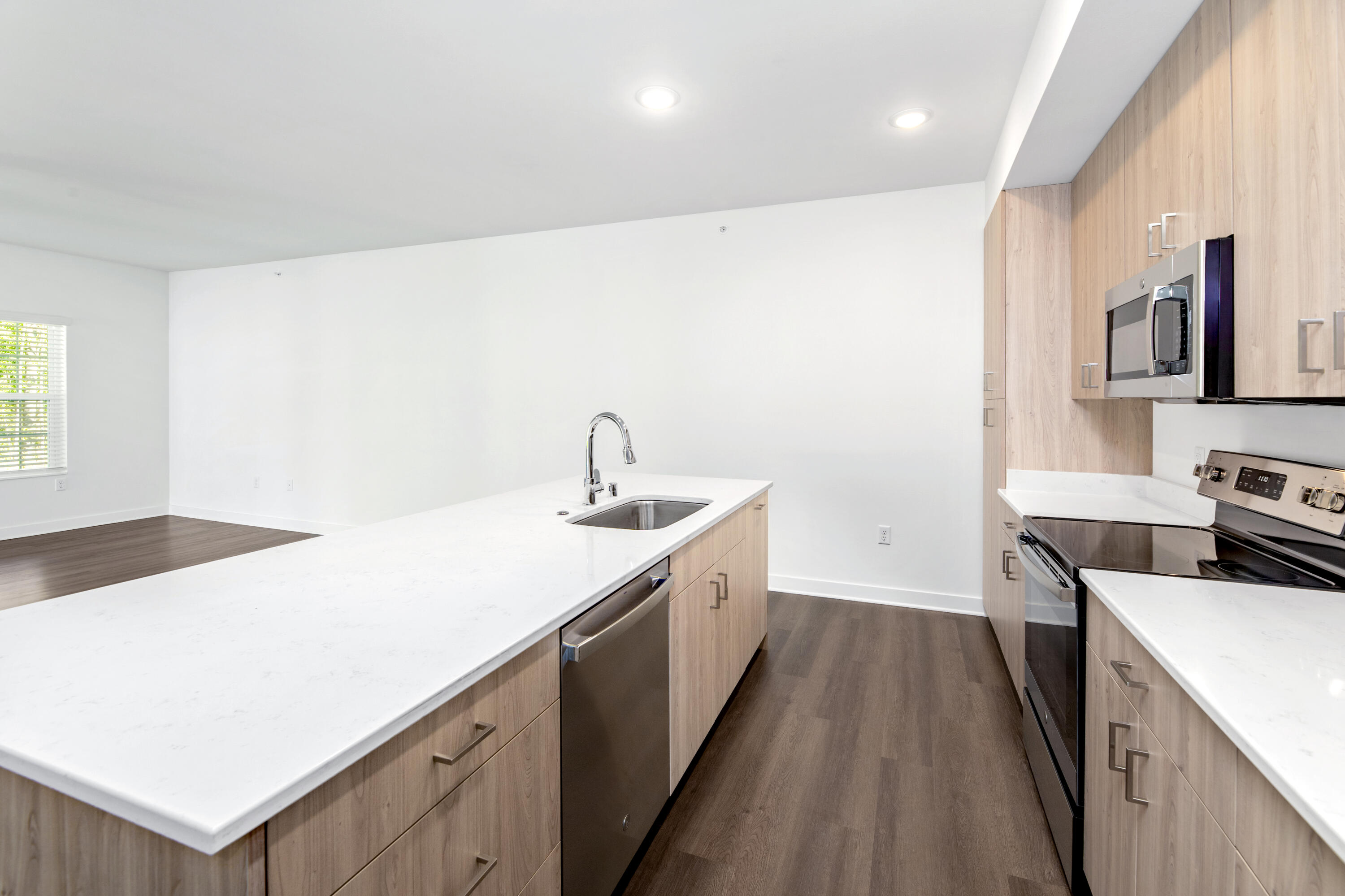 1811 West Wysteria Lane, Unit 605 Oak Creek, WI 53154 - Photo 7 of 33 Quartz countertops, undermount sink, kitchen island