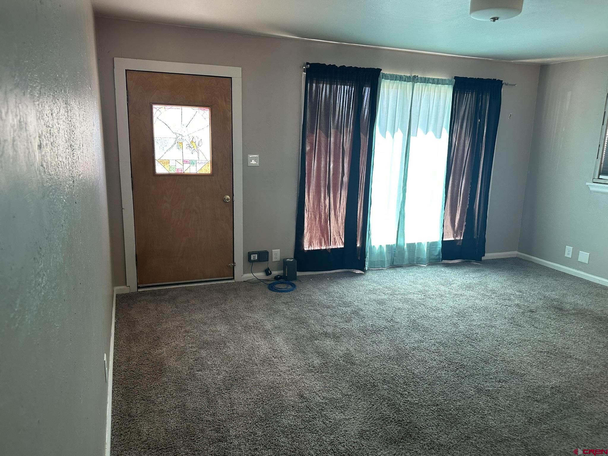 435 South Elm Street Cortez, CO 81321 - Photo 12 of 17 an empty room with windows
