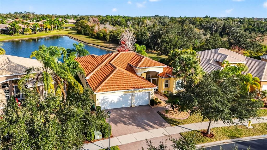 an aerial view of a house with a ocean view