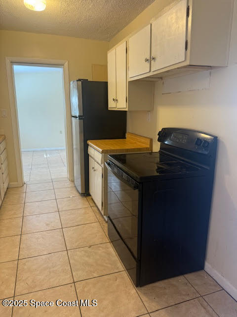 119 Explorer Street Cocoa, FL 32922 - Photo 4 of 19 a kitchen with stainless steel appliances granite countertop a stove and a refrigerator