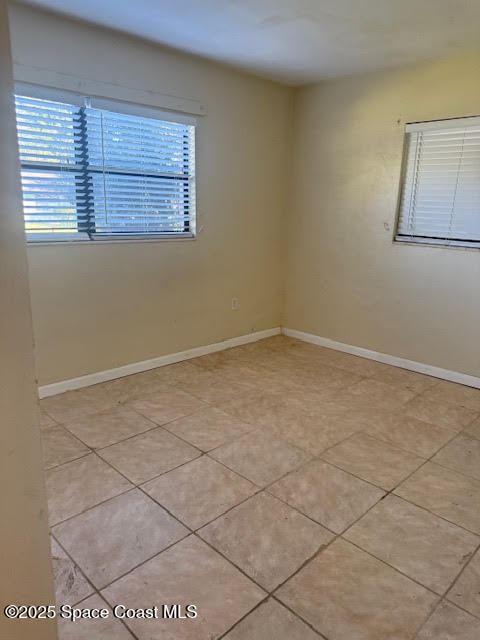 119 Explorer Street Cocoa, FL 32922 - Photo 5 of 19 an empty room with windows