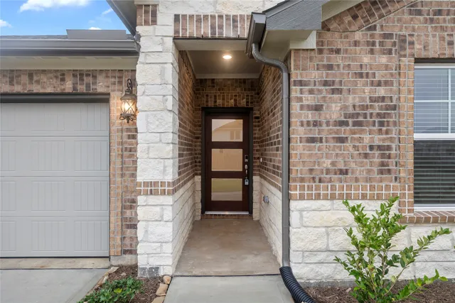 a front view of a house with a garage