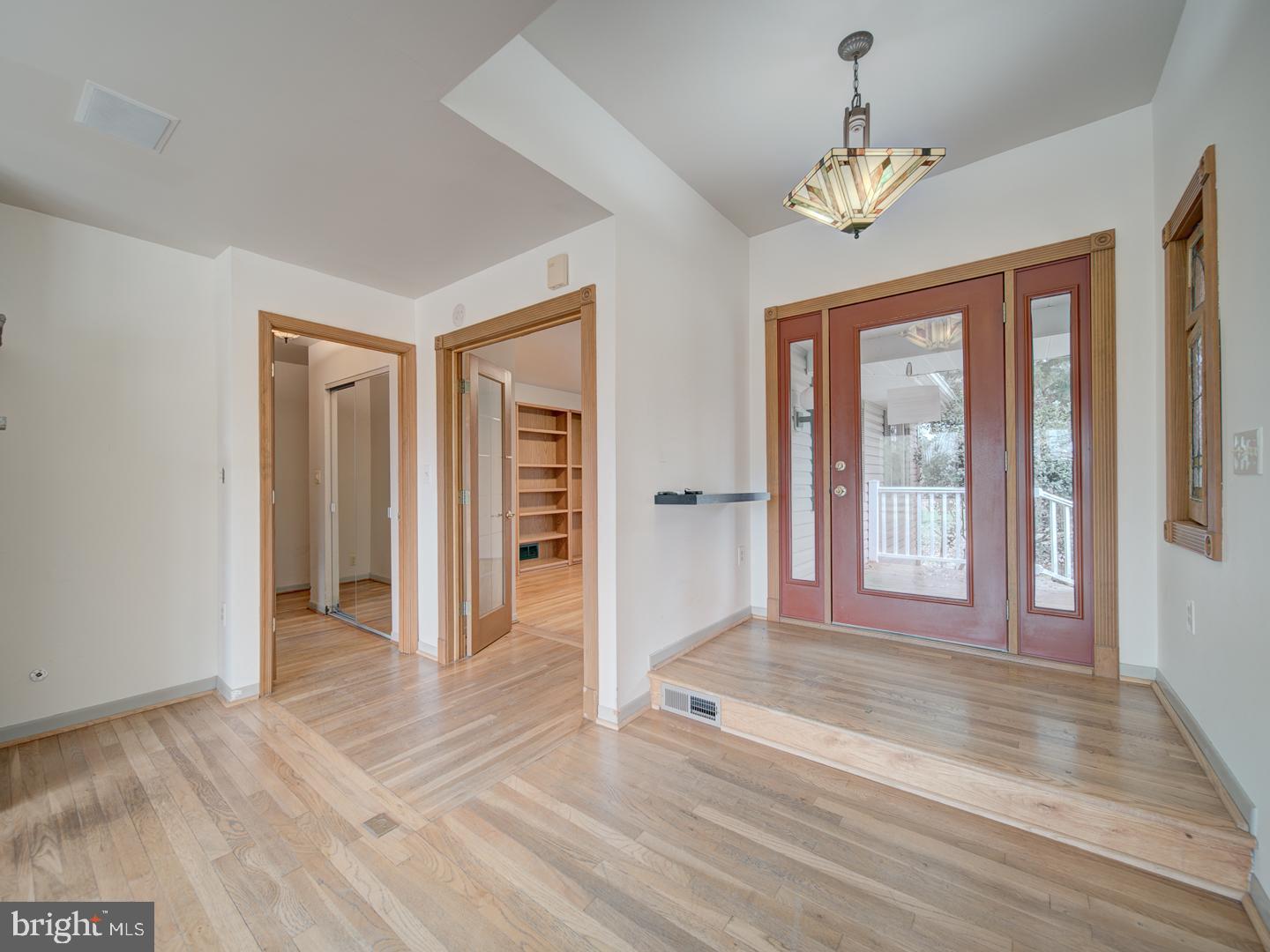 17520 Tranquility Road Purcellville, VA 20132 - Photo 12 of 70 a view of an empty room with wooden floor and a window