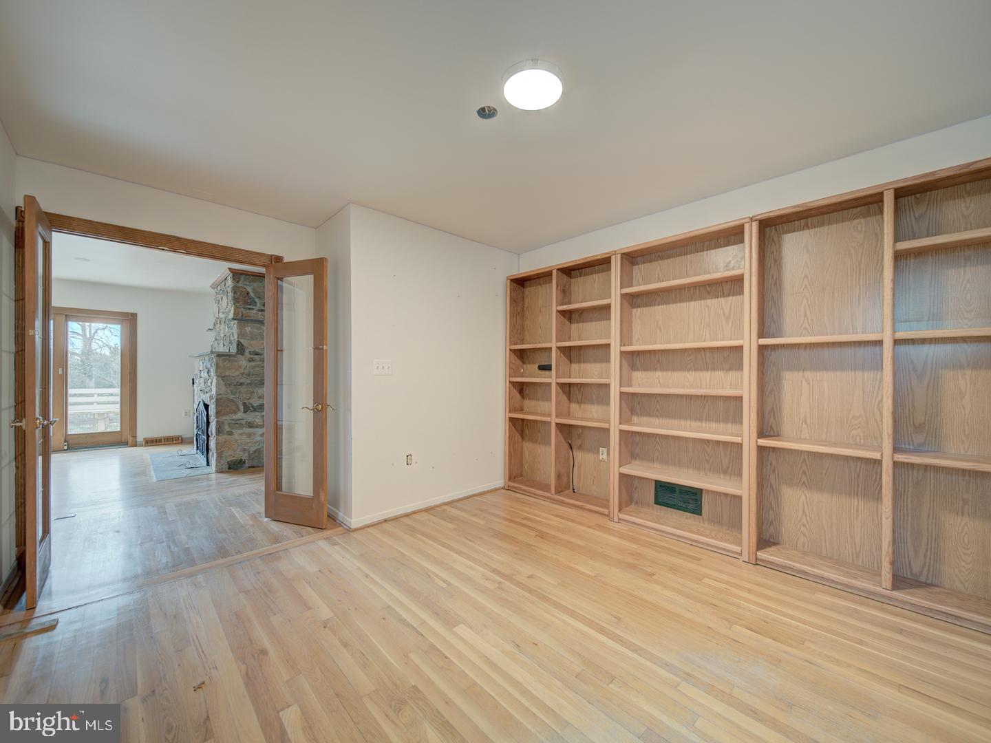 17520 Tranquility Road Purcellville, VA 20132 - Photo 16 of 70 a view of an empty room with wooden floor and closet