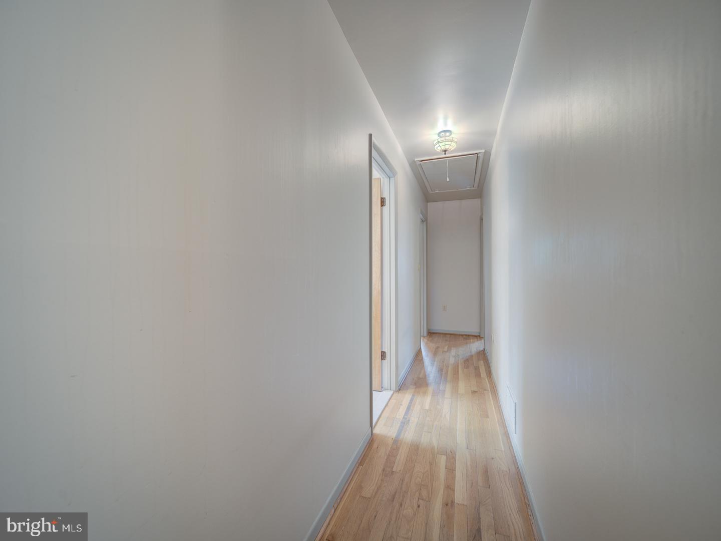 17520 Tranquility Road Purcellville, VA 20132 - Photo 24 of 70 a view of a hallway with wooden floor