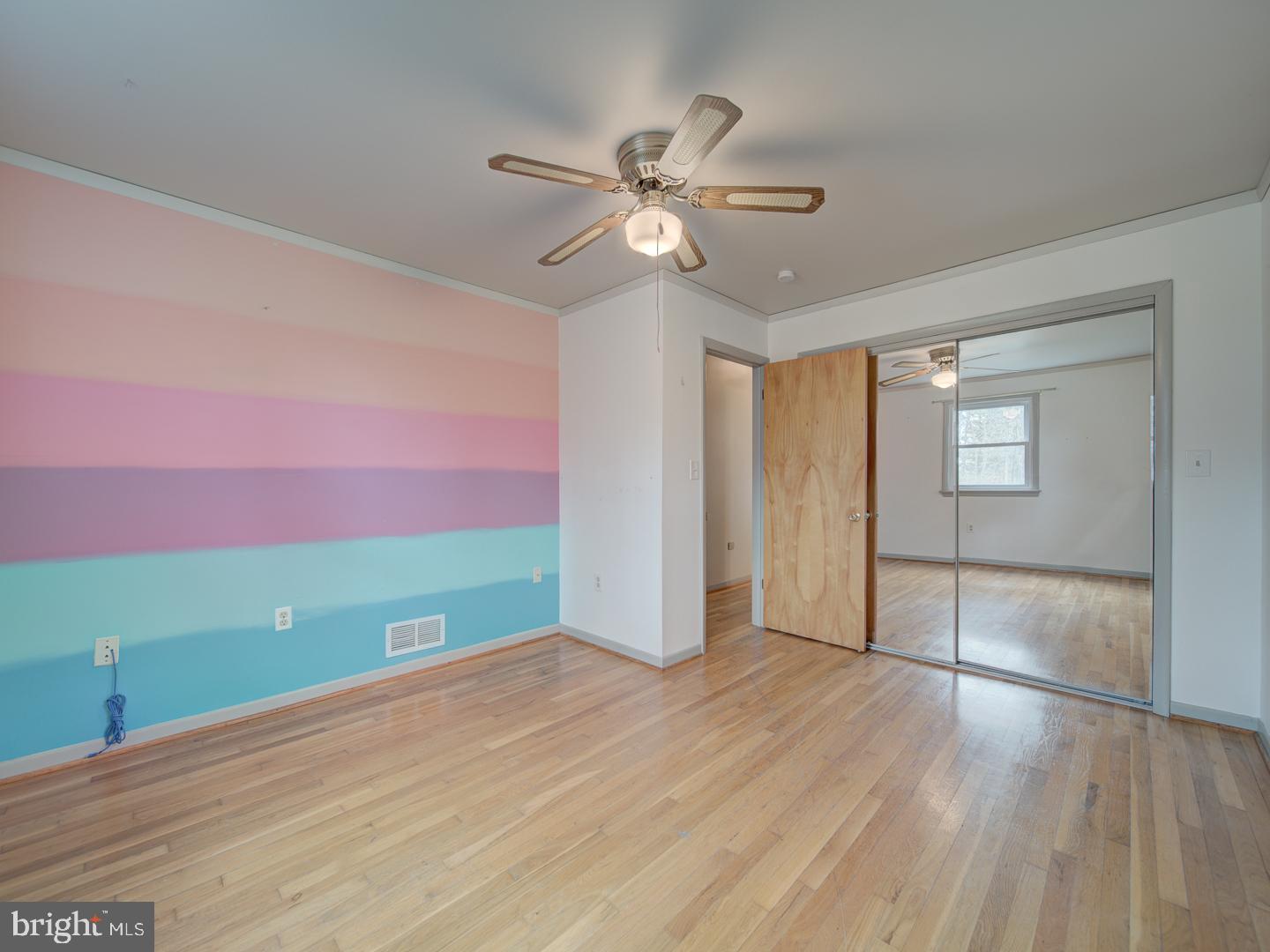 17520 Tranquility Road Purcellville, VA 20132 - Photo 30 of 70 a view of an empty room with window and wooden floor