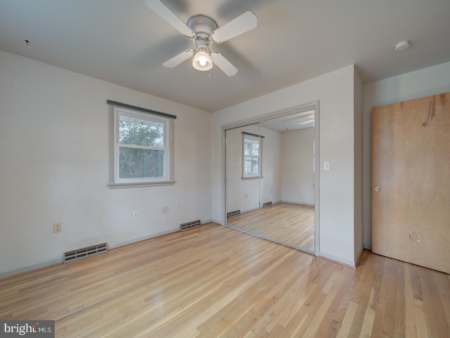 17520 Tranquility Road Purcellville, VA 20132 - Photo 35 of 70 a view of empty room with wooden floor and fan