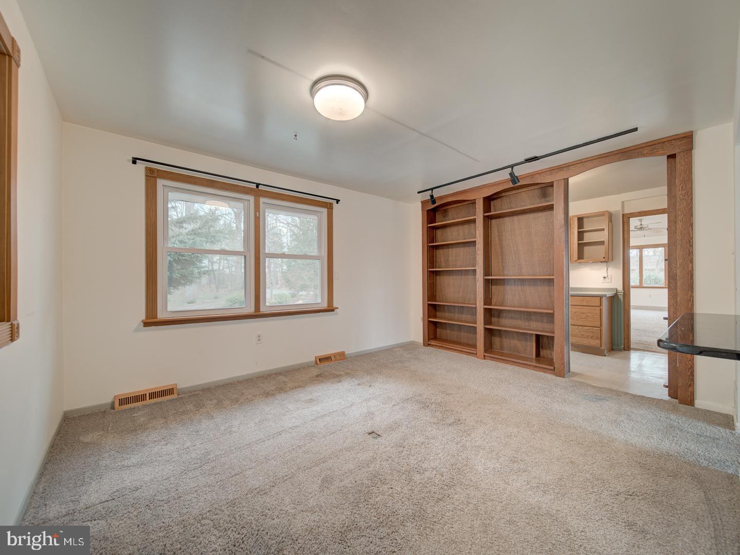 17520 Tranquility Road Purcellville, VA 20132 - Photo 36 of 70 an empty room with furniture and a window