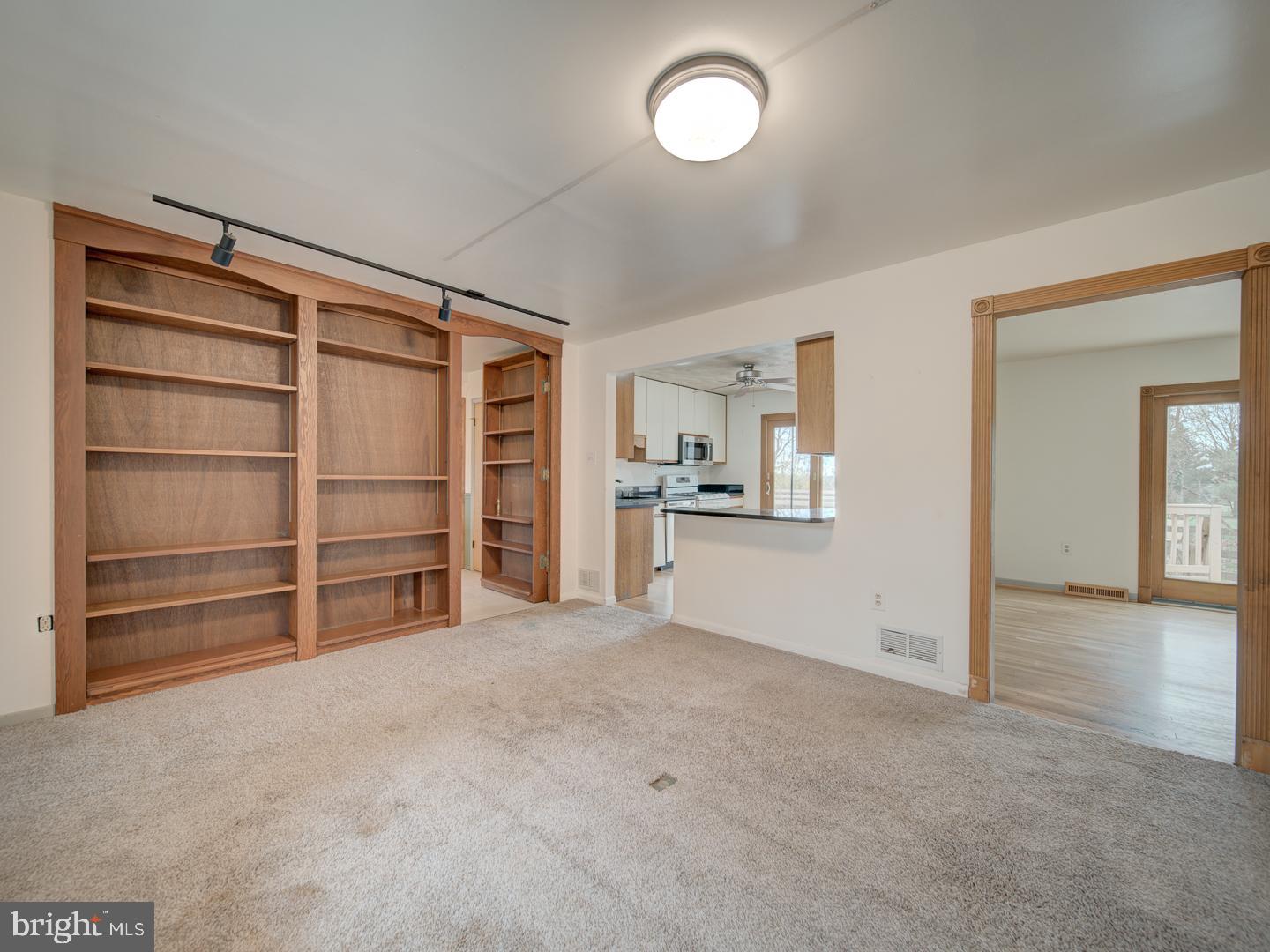17520 Tranquility Road Purcellville, VA 20132 - Photo 37 of 70 a view of a room with a cabinet and a refrigerator