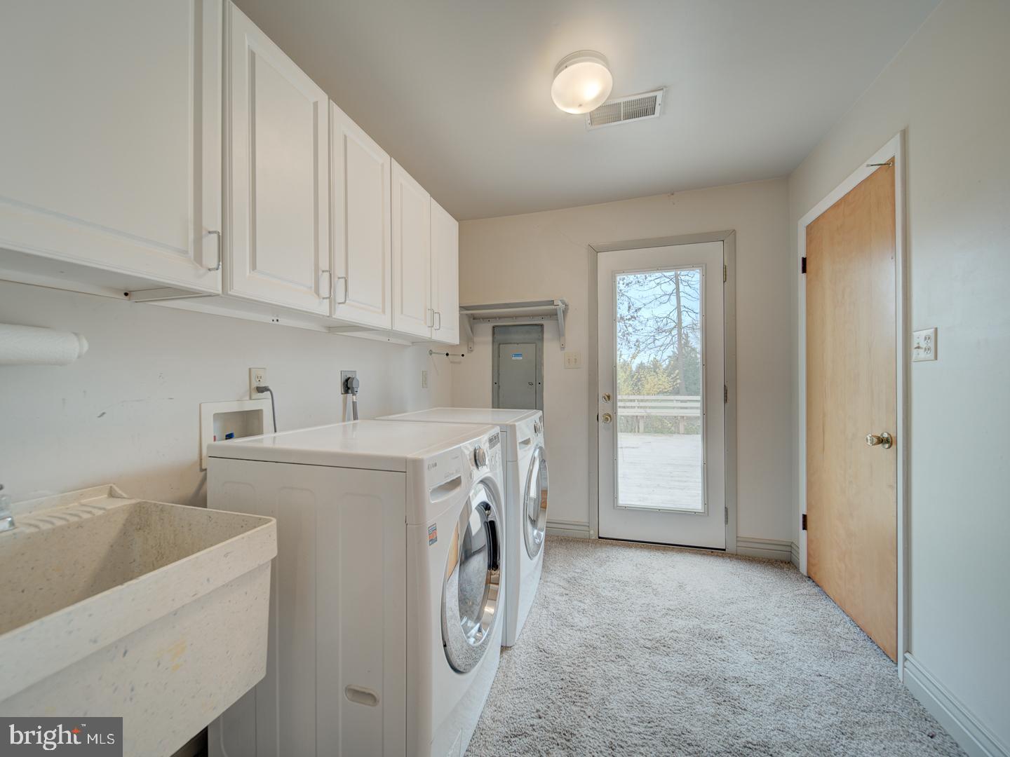 17520 Tranquility Road Purcellville, VA 20132 - Photo 51 of 70 a view of storage and utility room with washer and dryer