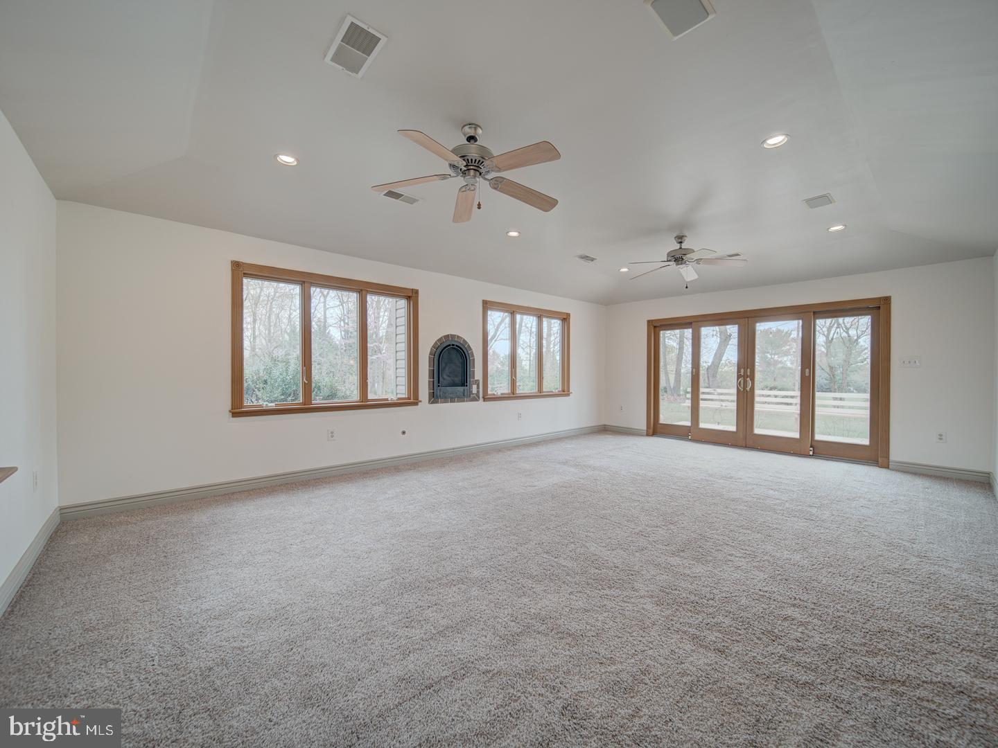 17520 Tranquility Road Purcellville, VA 20132 - Photo 52 of 70 a view of an empty room with a window and fireplace
