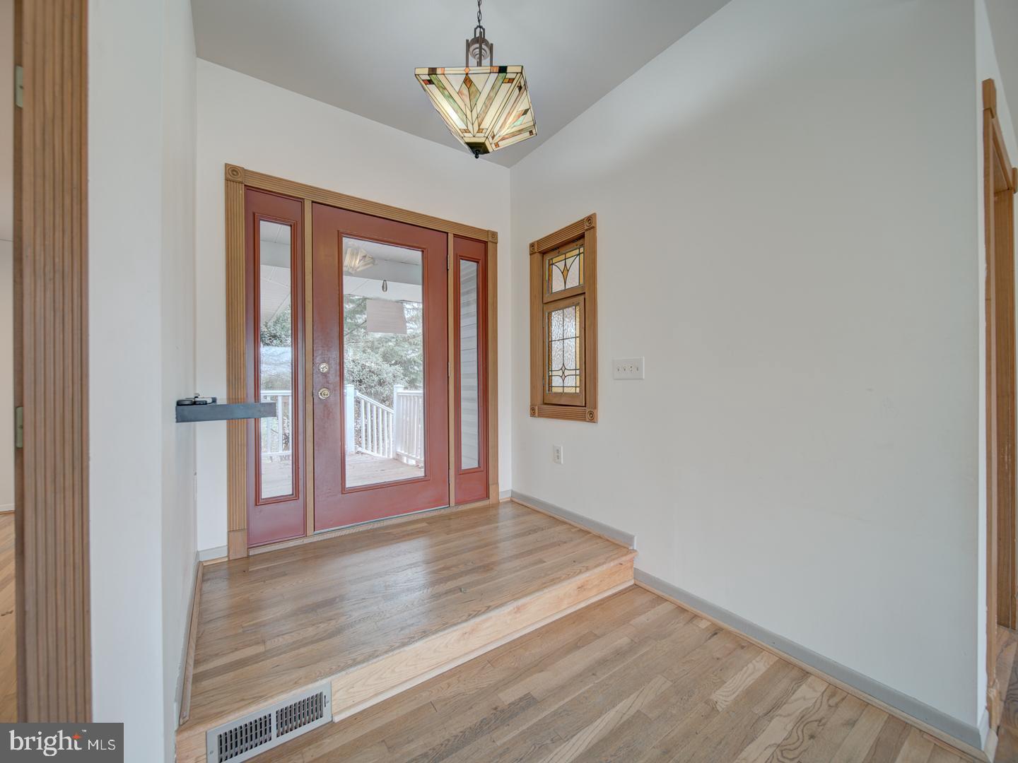 17520 Tranquility Road Purcellville, VA 20132 - Photo 6 of 70 a view of an empty room with a window
