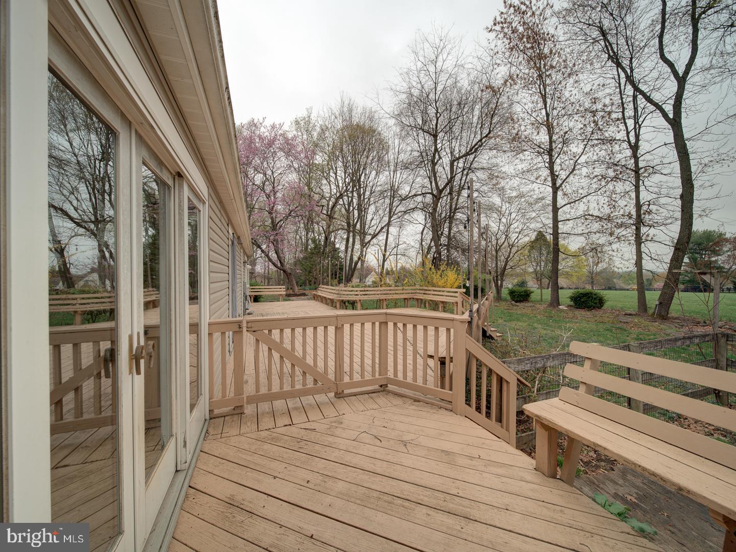 17520 Tranquility Road Purcellville, VA 20132 - Photo 64 of 70 a view of a wooden deck with trees