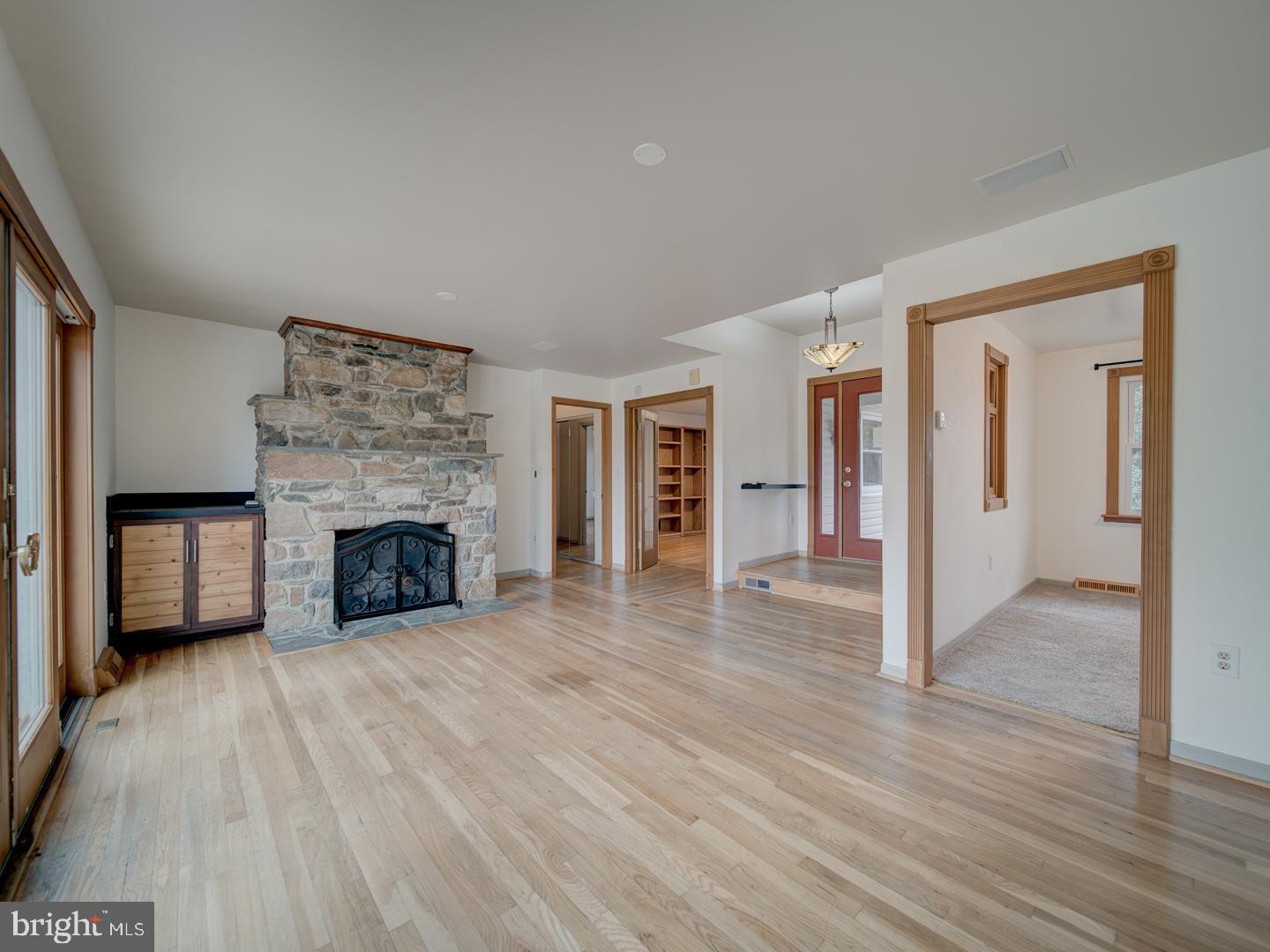17520 Tranquility Road Purcellville, VA 20132 - Photo 8 of 70 wooden floor fireplace and windows in an empty room
