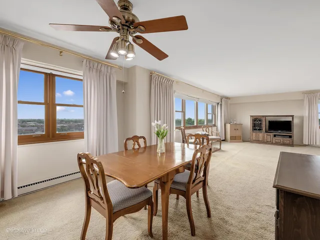 a dining room with furniture and window