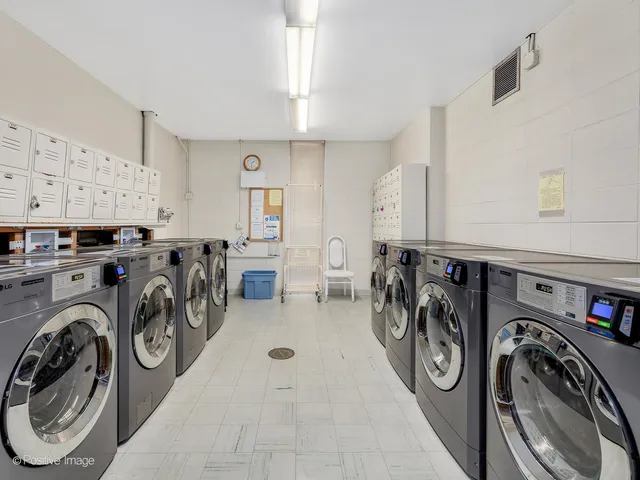 a utility room with multiple washing machine