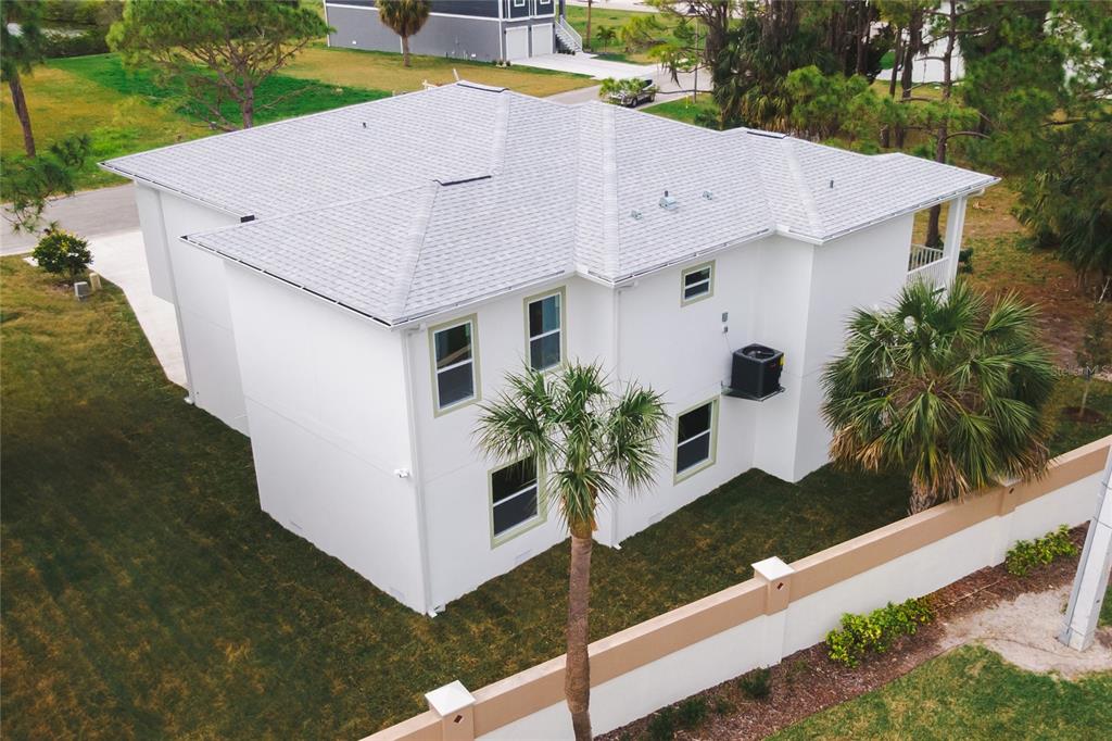 4829 Jenny Way New Port Richey, FL 34652 - Photo 23 of 30 a view of a house with a yard and potted plants