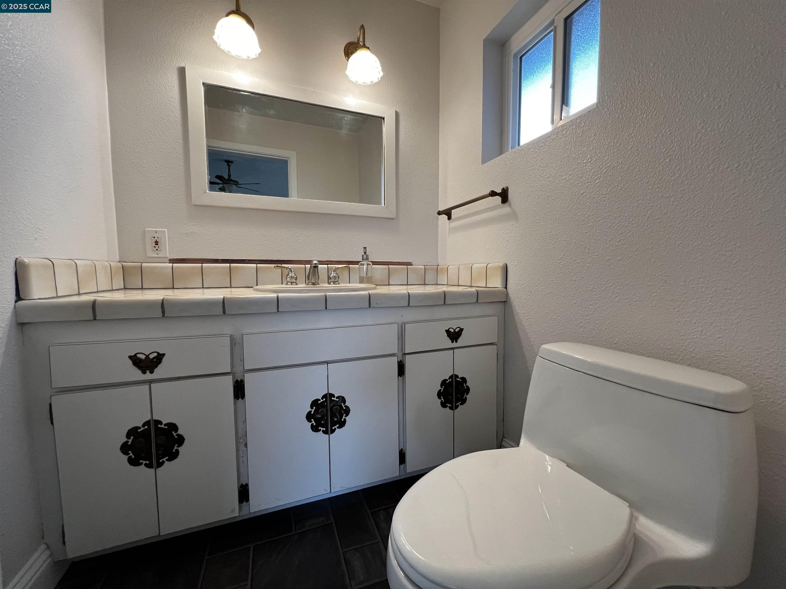 14630 St Croy Road Red Bluff, CA 96080 - Photo 12 of 29 a white toilet sitting next to a bathroom sink