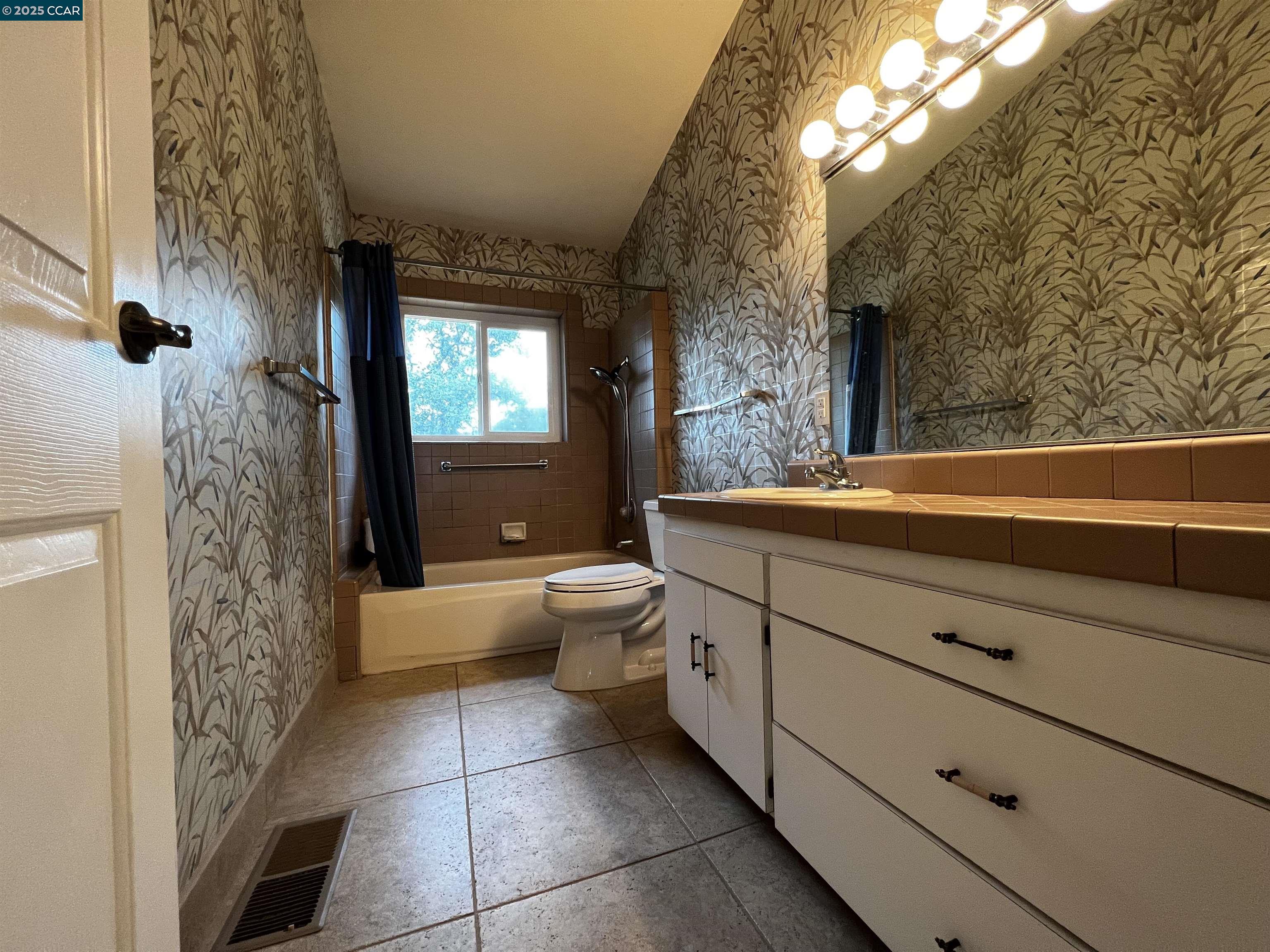 14630 St Croy Road Red Bluff, CA 96080 - Photo 13 of 29 a bathroom with a granite countertop sink a toilet and bathtub